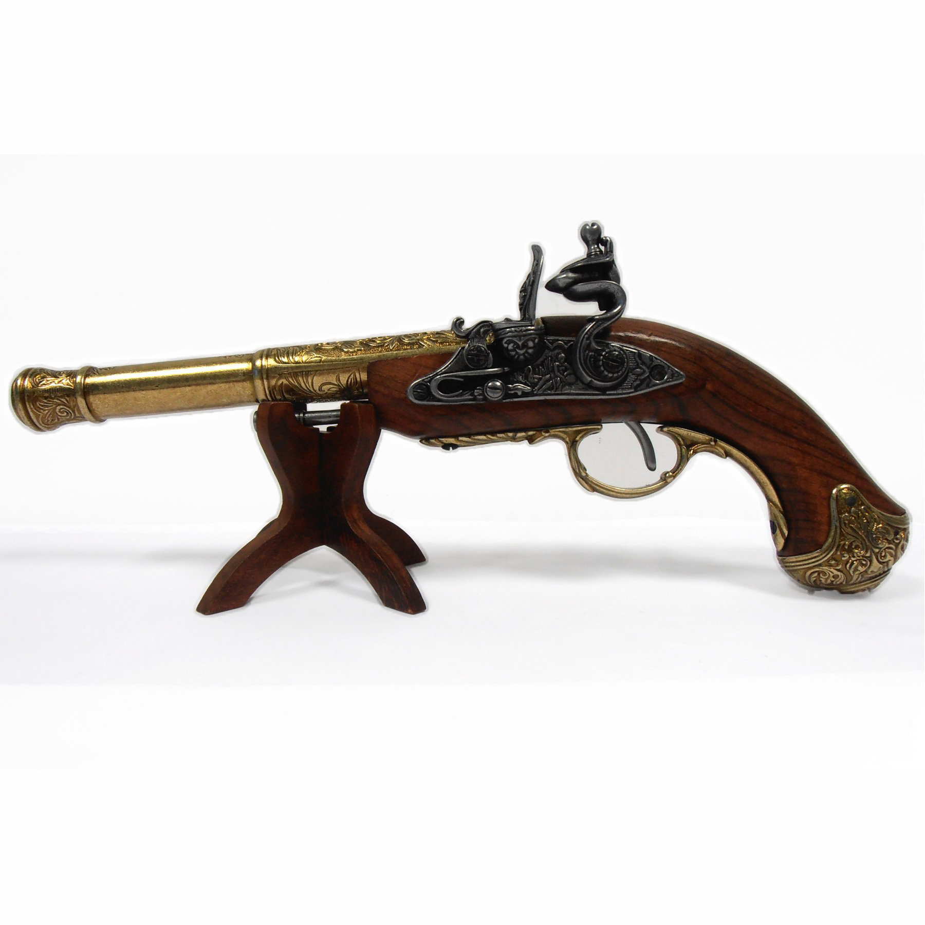 Left-handed flintlock pistol made of wood and brass-finished metal, India, 18th century