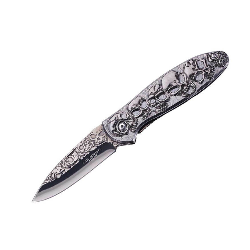 Pocket knife with an aluminum handle decorated with skulls and an...