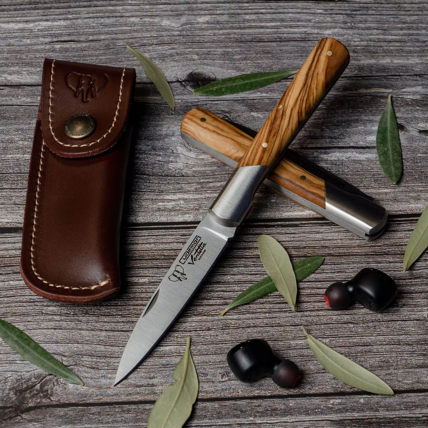 Cudeman Vendetta stiletto knife with ferrule. Olive wood handle. Includes leather sheath.