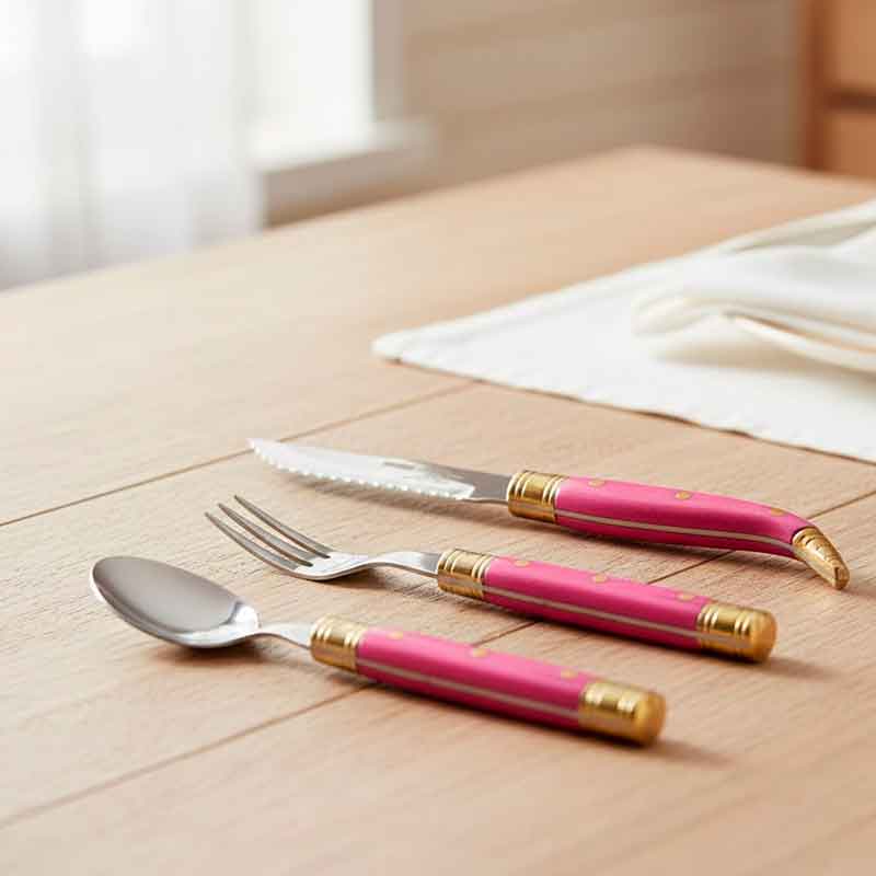 Steak knife with a serrated blade and pink micarta handle, shaped like a pocket knife