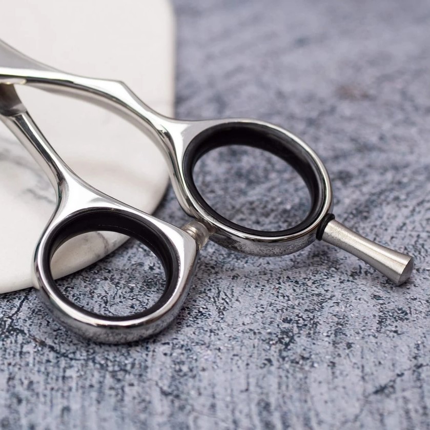 Tijera de peluqueria Toba 5.5" con filo navaja 3 Claveles